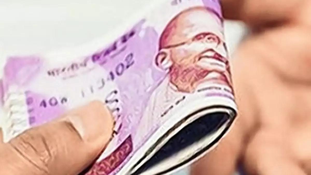 Rupee tumbles 14 paise to close at 83.96 against the US dollar as crude oil prices surge